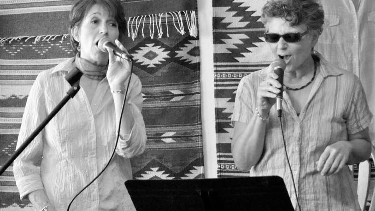 Jamie Jenson, left, and Susan Tuzzolino perform. Tuzzolino is the mistress of ceremonies and main organizer of Ladies igNite.
