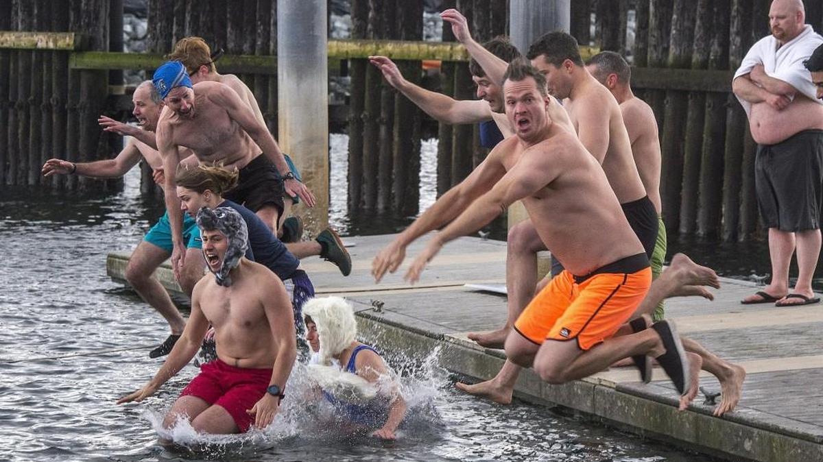 Hundreds braved cold salt water and unusually cold air temperatures to join the annual Polar Bear Plunge at the Point Defiance boat launch, January 1, 2017. Plunges are scheduled this year at Arcadia Boat Launch and Long Lake.