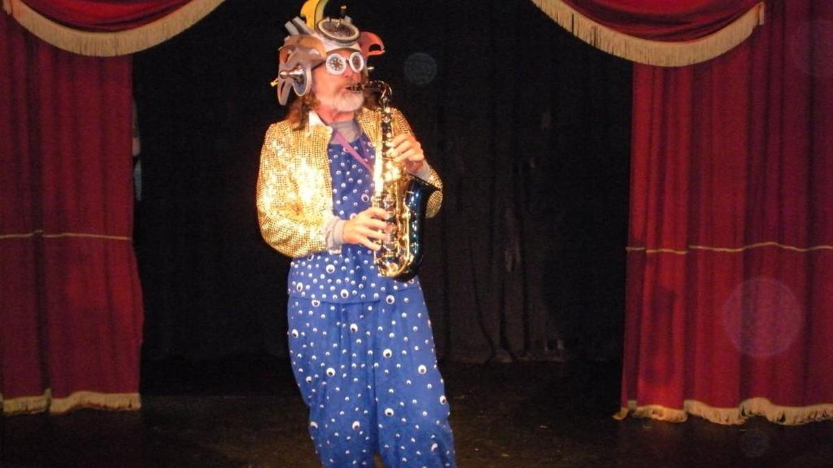 Al Barney plays the saxophone in Lord Franzannian Royal Olympian Spectacular Vaudeville Show.