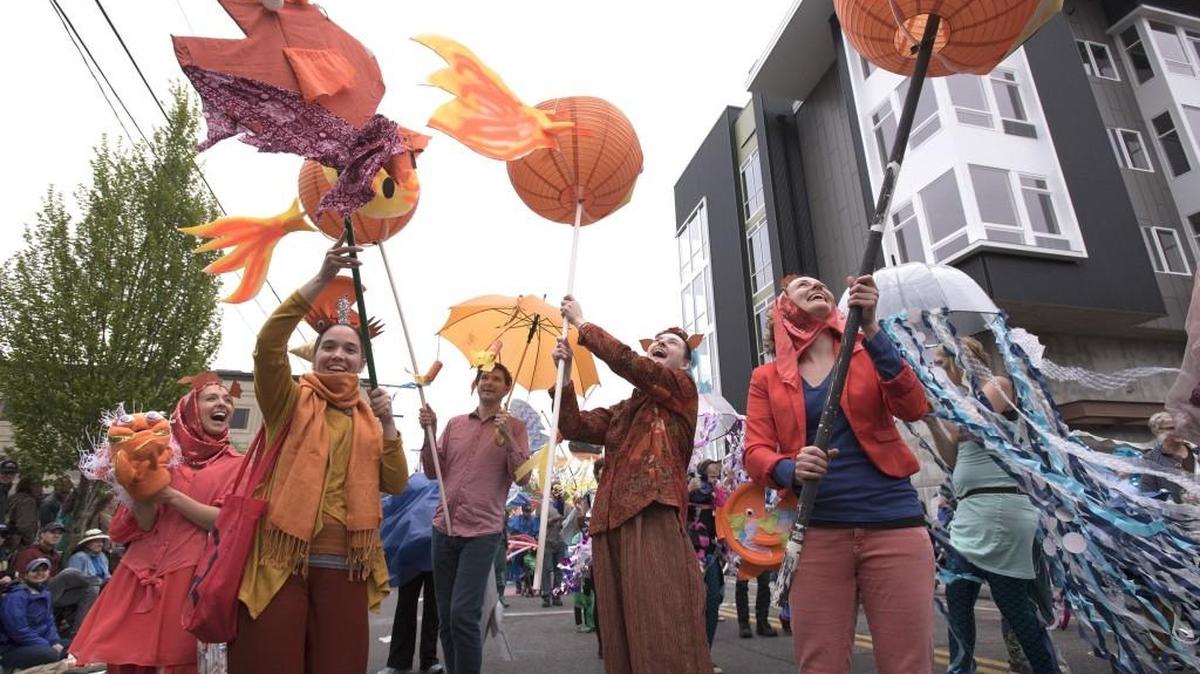 Puffer fish Claribel Gross, second from left, Jeff Painter, Jesse Morrow and Kira Batcheller battle the wind during the 2017l Procession of the Species in downtown Olympia. Weather may be a factor again this year, with showers expected Saturday.