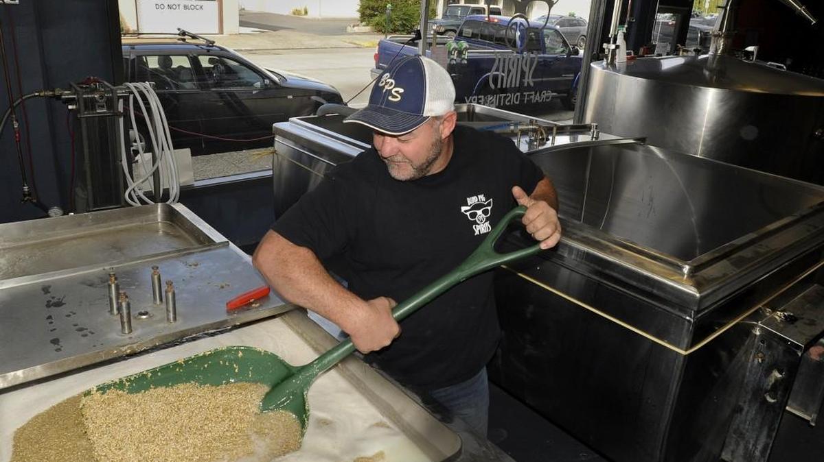 Blind Pig Spirits Craft Distillery and Tasting Room co-owner Ray Watson blends a vat of mash in September. Blind Pig is one of the distilleries featured in the South Sound Spirit’s Gathering.