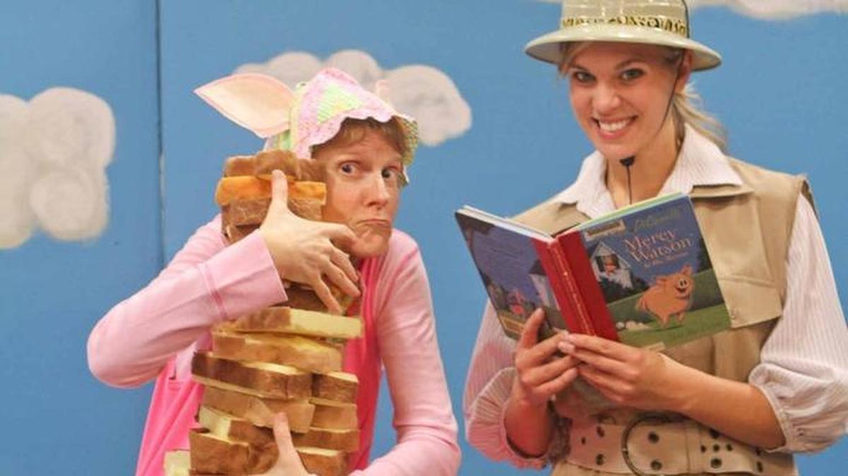 
Mercy the pig (played by Kate Ayers) is on a quest for toast while being chased by animal control officer Francine Poulet (Katrina Groen) in Olympia Family Theater’s “Mercy Watson Saves the Day,” which opens this weekend.
