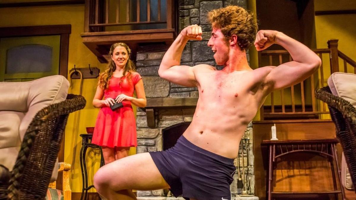 Alyssa Kay smiles as Jake Atwood poses in a scene from Harlequin Productions’ “Vanya and Sonia and Masha and Spike,” which is playing at Olympia’s State Theater.