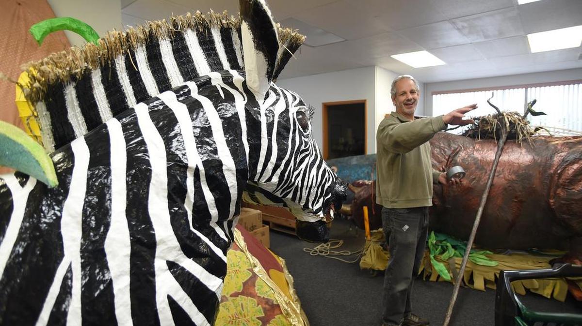 Jerry Berebitsky walks through the maze of life-like animal creations Feb. 14 as he and a workforce of community volunteers move into the new Procession of the Species studio on Water Street in Olympia.