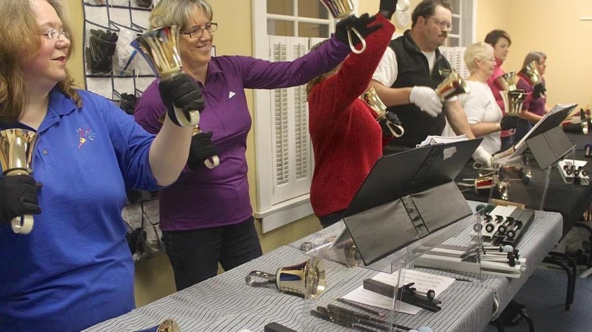 The Rainier Ringers bell choir rehearses for their Christmas concerts.
