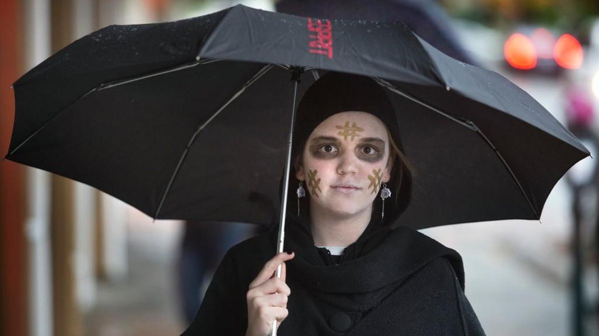 Nika Wolf, 13, of Olympia, dresses as a hashtag ghost for Halloween in downtown Olympia in 2015.