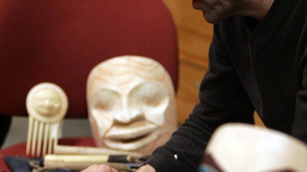 FILE PHOTO: David Boxley, a Tsimshian artist from Kingston, works on a carving at his booth at the Longhouse Holiday Native Art Fair on The Evergreen State College campus.