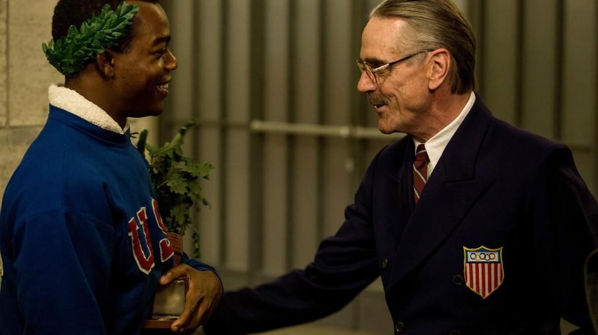 Stephan James, left, as Jesse Owens and Jeremy Irons as Avery Brundage, in “Race.”