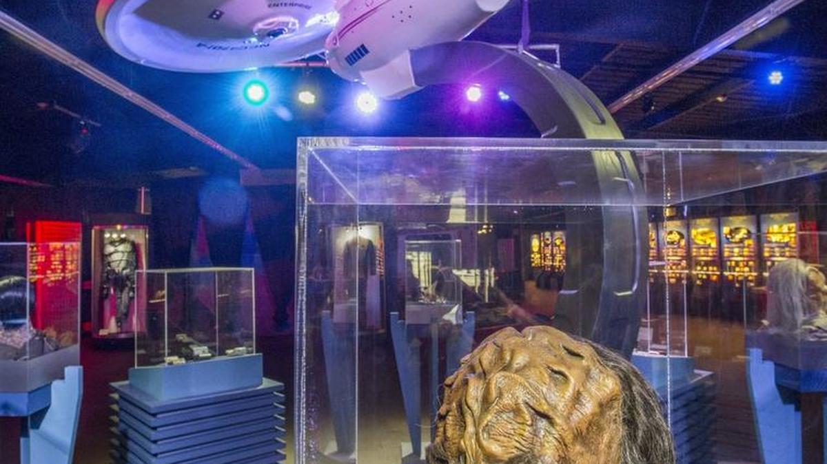 
A Klingon mask from “Star Trek: The Next Generation” sits in a case below a model of the star ship Enterprise in “Star Trek: The Exhibition.” It is the featured sideshow event at the Washington State Fair this year.
