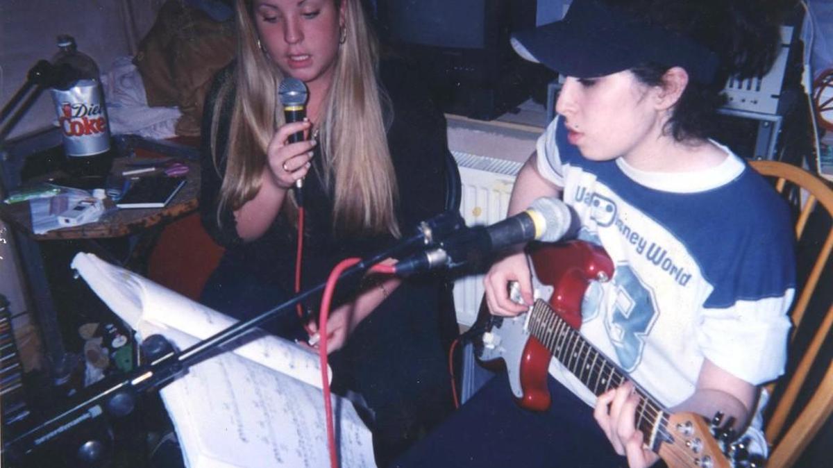 
The late singer Amy Winehouse, right, appears in a scene shot early in her life in the documentary film, “Amy.” 
