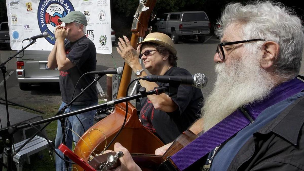 
The Citizens Band trio of Jim Cubbage, Grace Scott and Harry Levine, from left, performs songs with a working-class theme at the 2014 Labor Day Picnic, held Sept. 1 at Tumwater Falls Park.
