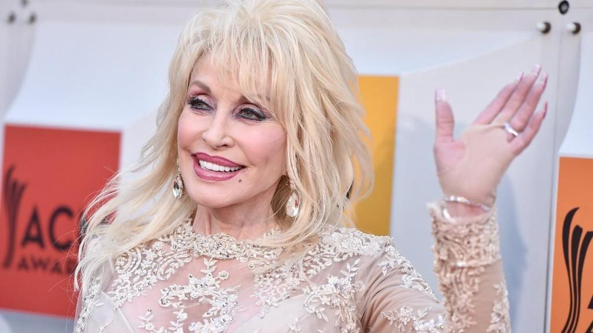 Dolly Parton arrives at the 51st annual Academy of Country Music Awards April 3 in Las Vegas. Parton announced Monday she will perform Sept. 21 at the ShoWare Center in Kent.