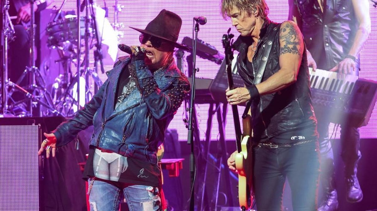 Axl Rose, left, will be joined by Duff McKagan, right, and Slash when Guns N’ Roses performs Aug. 12 at CenturyLink Field in Seattle.