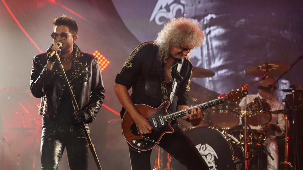 Adam Lambert, from left, Brian May and Roger Taylor of Queen + Adam Lambert perform at the United Center in 2014 in Chicago. They will perform July 1 at KeyArena in Seattle.