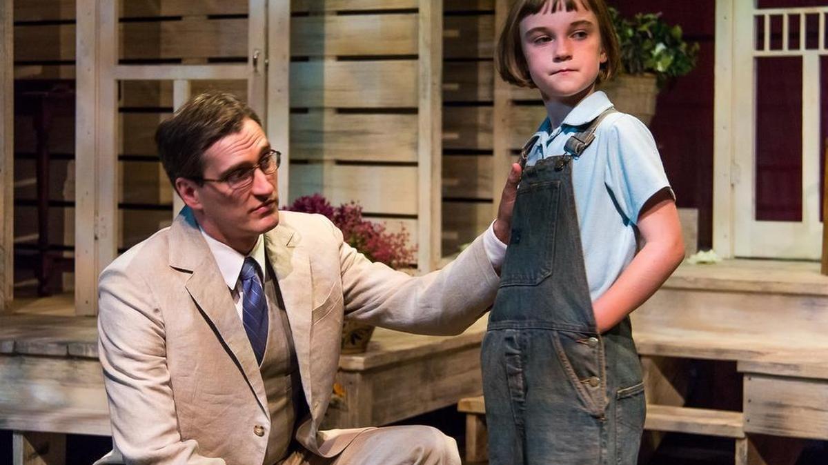 
Aaron Lamb, left, and Loren Kattenbraker play Atticus and Scout Finch in Harlequin Productions’ “To Kill a Mockingbird.” The story follows Atticus as he attempts to defend a black man accused of raping a white woman, and Scout as she learns the meaning of courage. 
