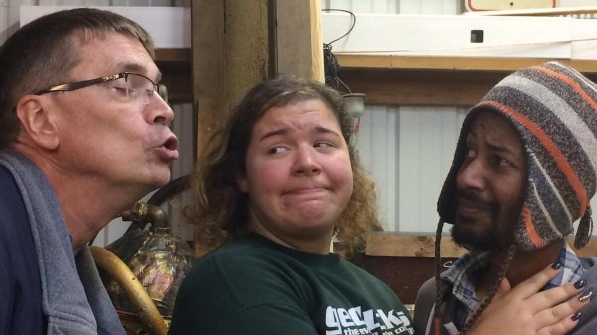 Lou Perkins (Sara Geiger) avoids a kiss from the Fabulous Harold Ash (Jeff Kingsbury) while her faithful assistant Wednesday (Jordan Richards) looks on, in Bryan Willis’s “Bicycle Noir,” a film noir parody.