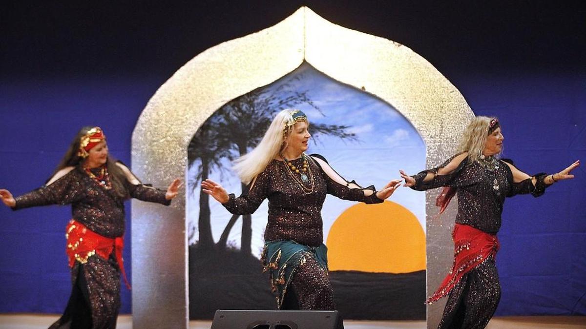 Members of the Shahrazad Dance Ensemble of Seattle Betty Bigelow, from left, Su Nelson and Barb Smith perform an Egyptian Shaabi dance — the dance of the “country people” — during the Olympia Arab Festival in 2014.