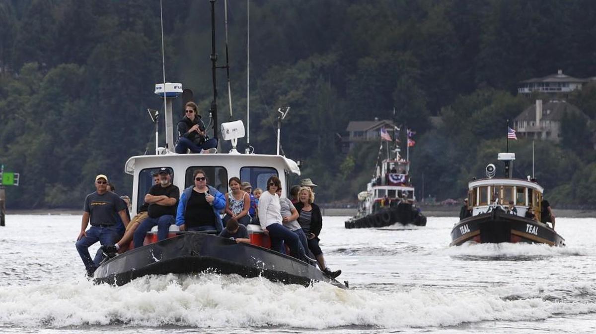 
Battling in the harbor tug-class racing heat, the It’s the Snee-Oosh, Thea Belle and Teal, left to right, head for the finish line Aug. 31 during the 2014 Harbor Days tugboat races on Budd Inlet. This year’s Harbor Days starts Friday (Sept. 4) and goes through Sunday.
