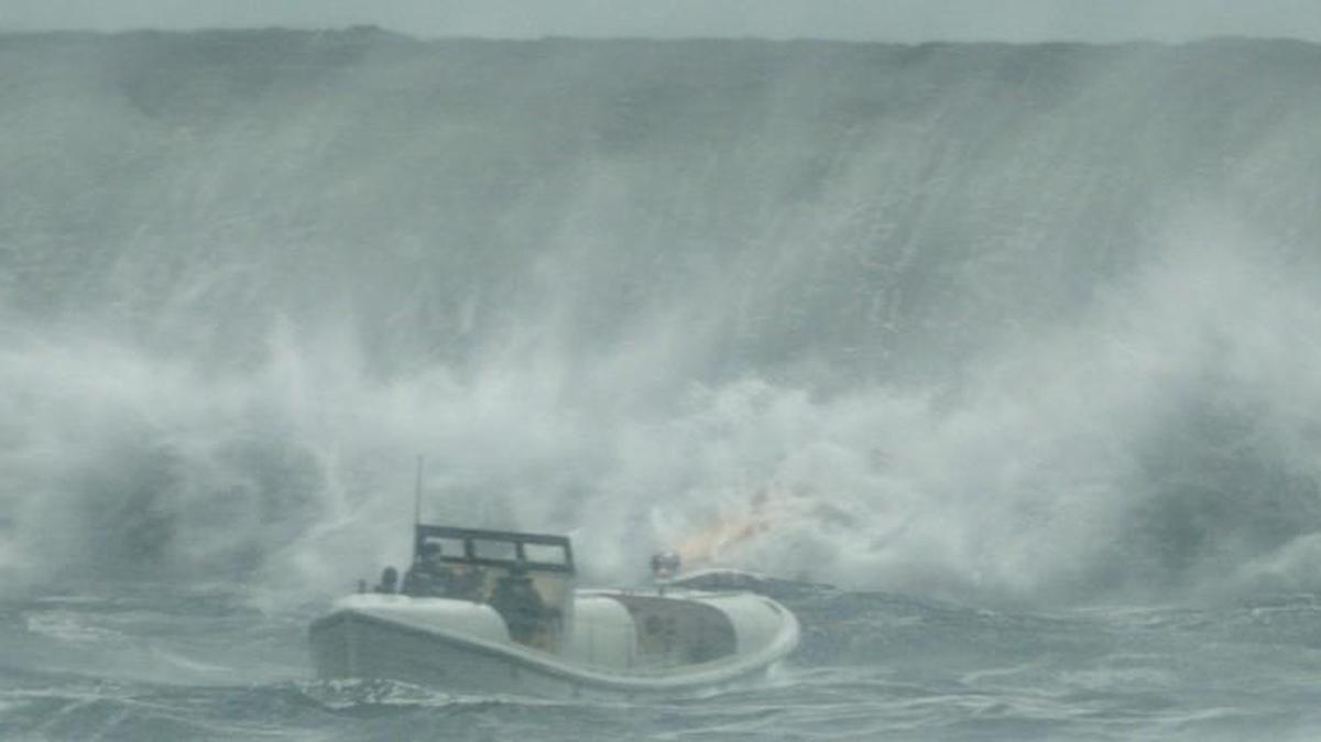 A massive wave bears down on a rescue ship in “The Finest Hours.”