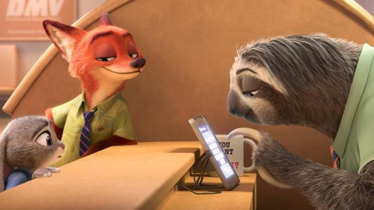 Judy Hopps, voiced by Ginnifer Goodwin, left, and Nick Wilde, center, voiced by Jason Bateman, in “Zootopia.”