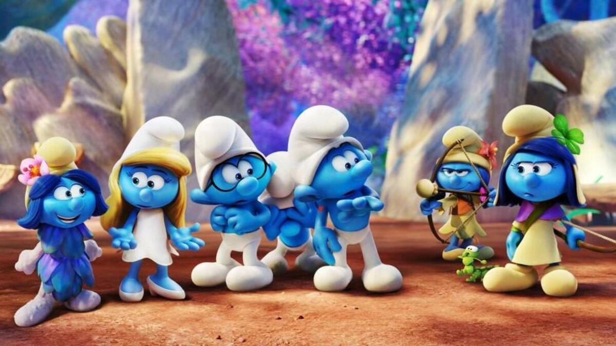 Smurfblossom (Ellie Kemper), from left, Smurfette (Demi Lovato), Brainy (Dany Pudi), Clumsy (Jack McBrayer), Hefty (Joe Manganiello), Smurflily (Ariel Winter) and Smurfstorm (Michelle Rodriguez) in “Smurfs: The Lost Village.”