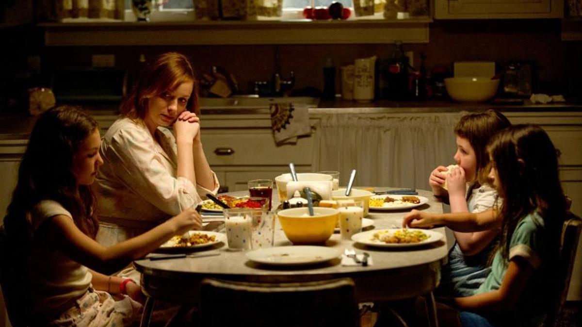 
Christina Hendricks, second from left, stars in “Dark Places,” a dull flick about a massacre survivor and a cast of creepy characters. It’s dark, dreary and probably not worth your time. 


