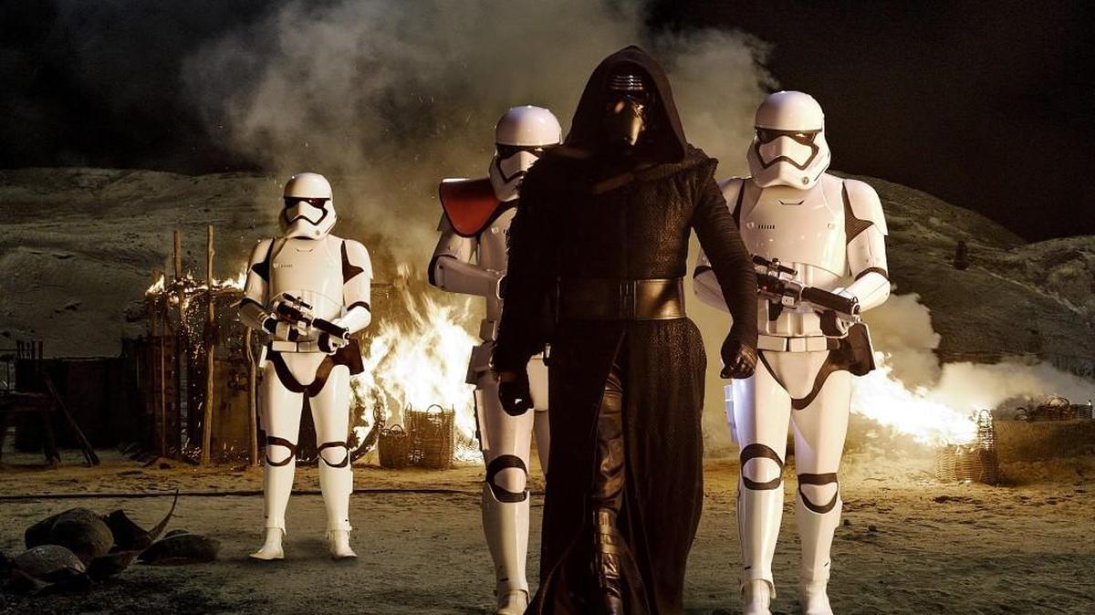 Kylo Ren (Adam Driver) with Stormtroopers in “Star Wars: The Force Awakens.”