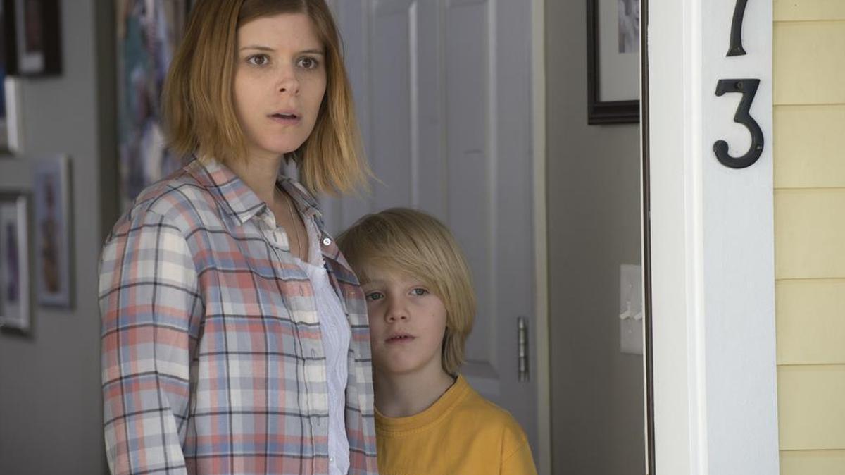 A U.S. Marine returns from war to search for his family played by Kate Mara, left, and Charlie Shotwell in “Man Down.”