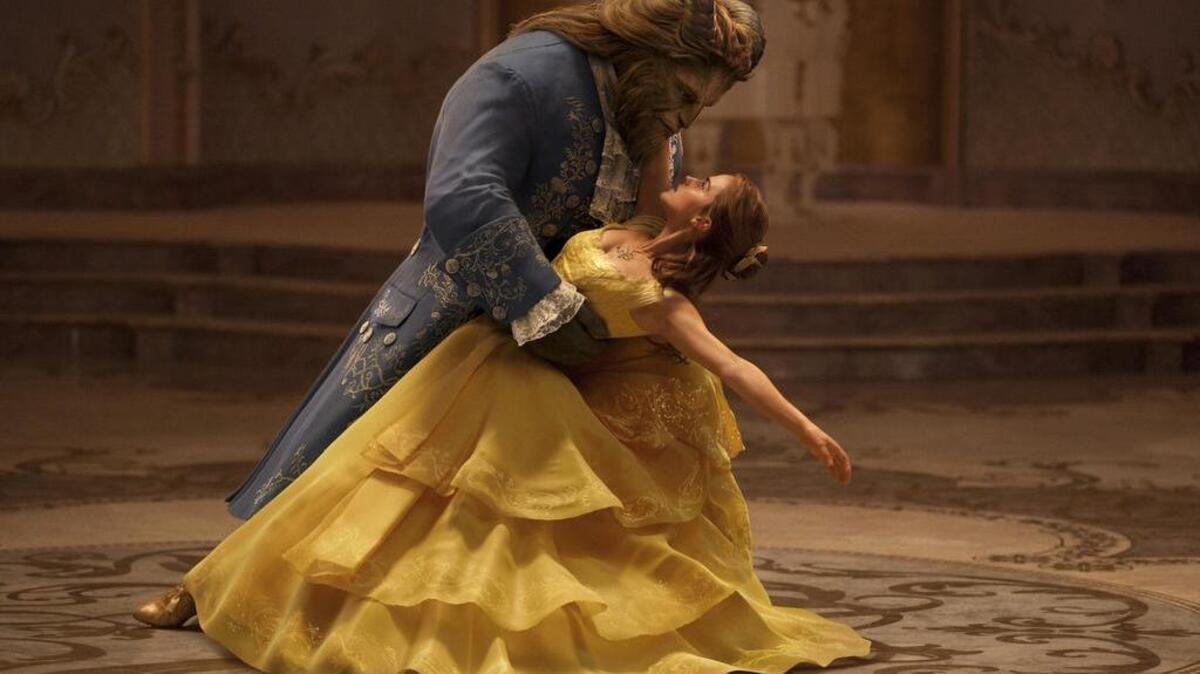 Emma Watson plays a beauty, right, and Dan Stevens the beast, in the live-action adaptation of the Disney classic “Beauty and the Beast.”