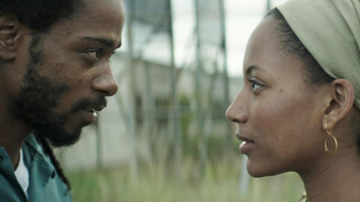 This image released by IFC Films shows Lakeith Stanfield, left, and Natalie Paulin “Crown Heights.”