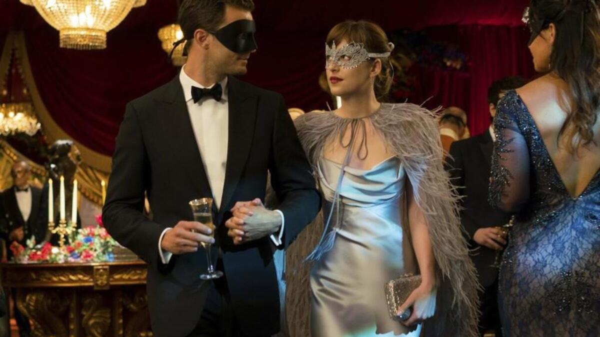Jamie Dornan as Christian Grey, left, and Dakota Johnson as Anastasia Steele in “Fifty Shades Darker.”