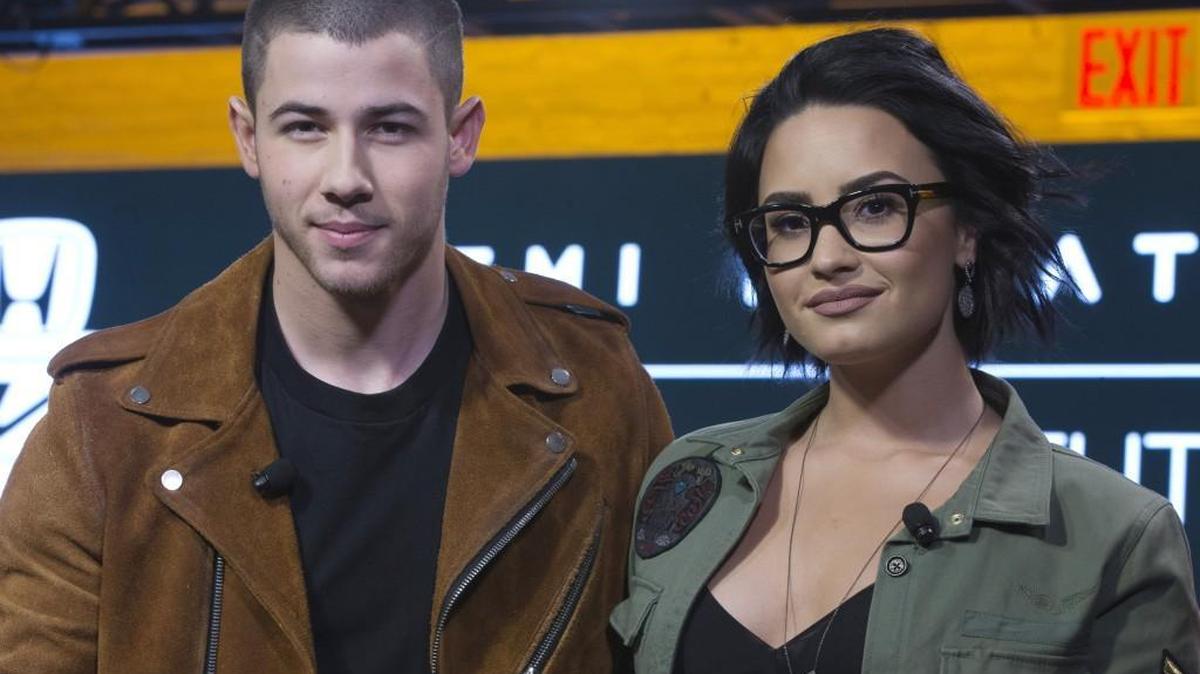 Demi Lovato, right, and Nick Jonas appear onstage during a Honda-sponsored news conference Tuesday in New York.