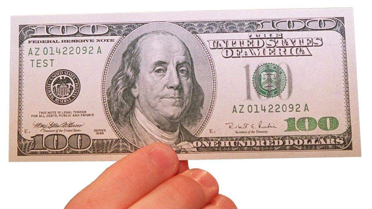 FILE--The Treasury Department is planning a multimillion-dollar push to educate bankers and investors worldwide about the new $100 bill and other redesigned currency. The campaign includes a contract with a private public relations firm for up to $31.7 million. In the next few weeks, the Treasury will roll out its new $100 bill with enhanced anti-counterfeiting features and a larger portrait of Ben Franklin. It’s aimed at foiling forgers who wield modern copy machines and computer scanners instead of the old-fashioned engraving plate. (AP Photo/Denis Paquin)