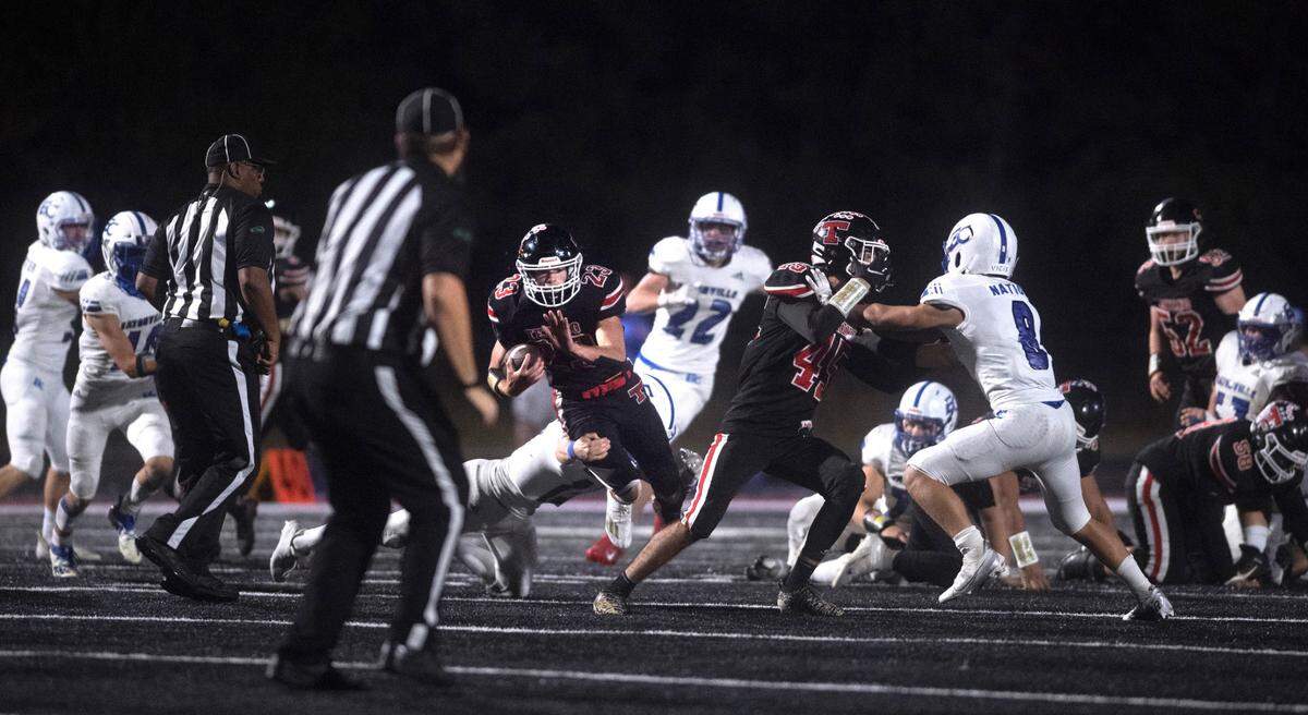 Tenino running back Dylan Spicer slices through the Eatonville defense during Friday night’s 2A football game at Tenino Beaver Stadium in Tenino, Washington, on Sept. 30, 2022. Eatonville won the game, 27-22.