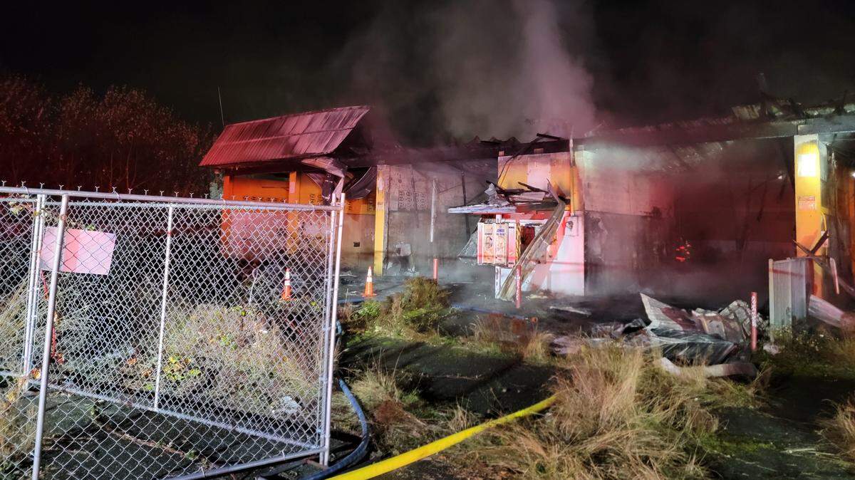Flames destroyed a vacant car wash building at Capitol Boulevard and Gerth Street in Tumwater on Tuesday night, Nov. 15.