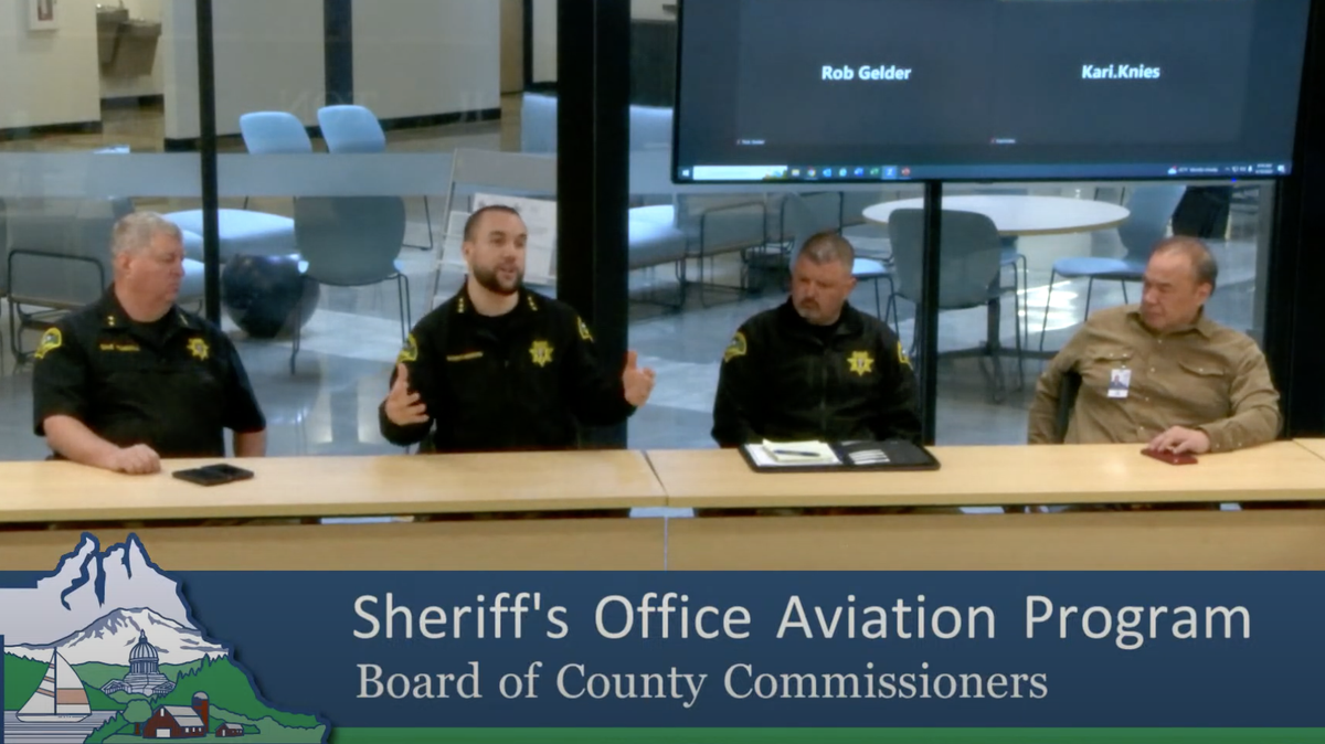 Thurston County Sheriff Derek Sanders, second from the left, said Wednesday he’s close to obtaining a military surplus helicopter for search and rescue efforts. He made a presentation to the Board of County Commissioners.