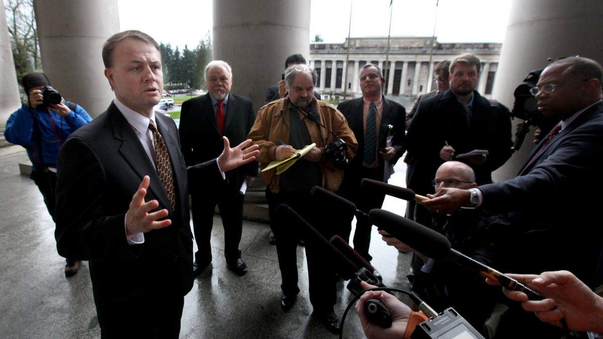 Tim Eyman stands at the entrance to the Legislative Building in 2013, after the Washington State Supreme Court struck down Initiative 1053 as unconstitutional. Eyman’s newly filed financial statement with the state Public Disclosure Commission, now that he’s announced a run for governor, appears to be in sharp contrast with his monthly reports in federal court, where he filed for bankruptcy one year ago. 
