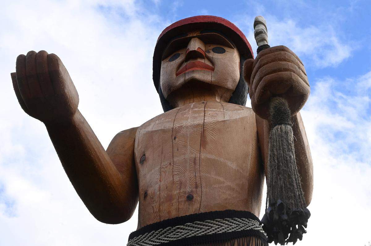 Welcome figure sculpture of Steh-Chass Man at a home just south of Squaxin Park in Olympia.
