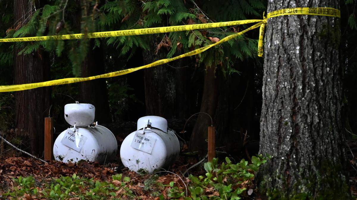 Fuel containers sit near the scene of a suspected carbon monoxide poisoning at a campus modular housing unit at The Evergreen State College. One student died and two other students were hospitalized the evening of Monday, Dec 11. One of the sickened students was released from the hospital on Wednesday.