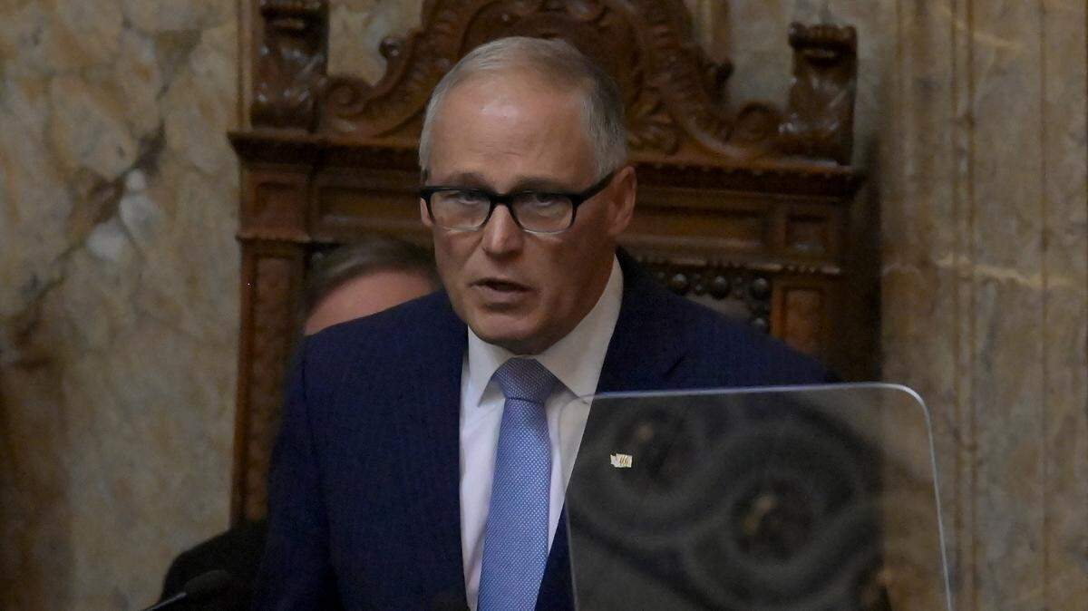 Washington state Gov. Jay Inslee gives his 2023 State of the State address in the House Chambers of the Legislative Building in Olympia on Jan. 10, 2023