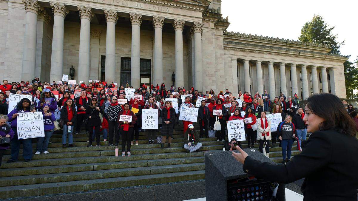 State Sen. Yasmin Trudeau, D-Tacoma, addresses hundreds of advocates for low-income housing rallying on the steps of the Legislative Building in Olympia on Tuesday, Jan. 30, to bring their message to lawmakers gathered for the 2024 short session. The rally was part of the the Washington Low Income Housing Alliance’s Housing and Homelessness Advocacy Day.