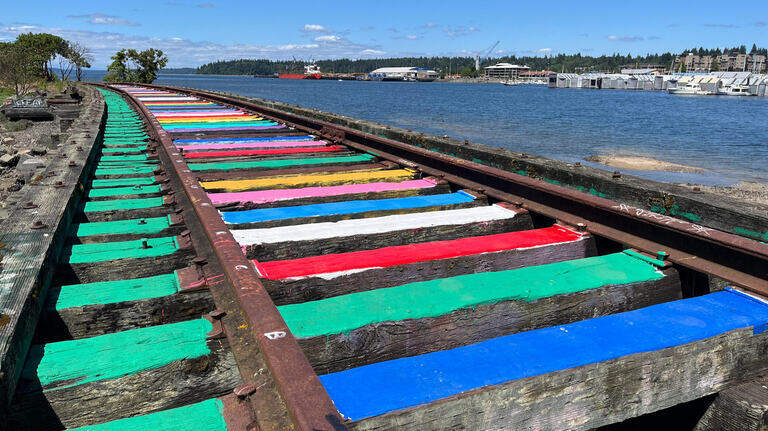 Olympia volunteers repaint ‘Rainbow Rails’ after longtime attraction was defaced
