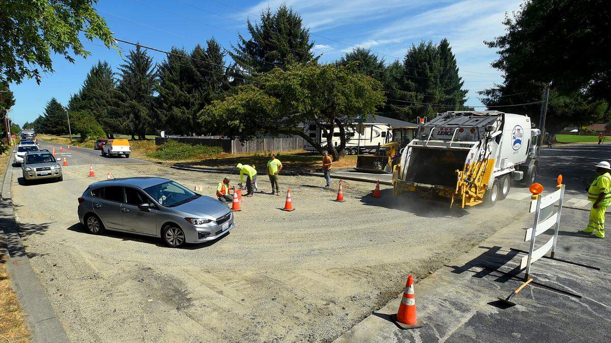 With a very slight drop from Wednesday’s upper 90’s to the high 80’s in temperature crews continue work on the summer paving project along Rainier Road SE and Balustrade Blvd. in Lacey on Thursday, Aug. 17. Yesterday’s sizzling temperatures forced the project to a 1-day, 4-9pm work window to allow more time for the new asphalt material to cool down.