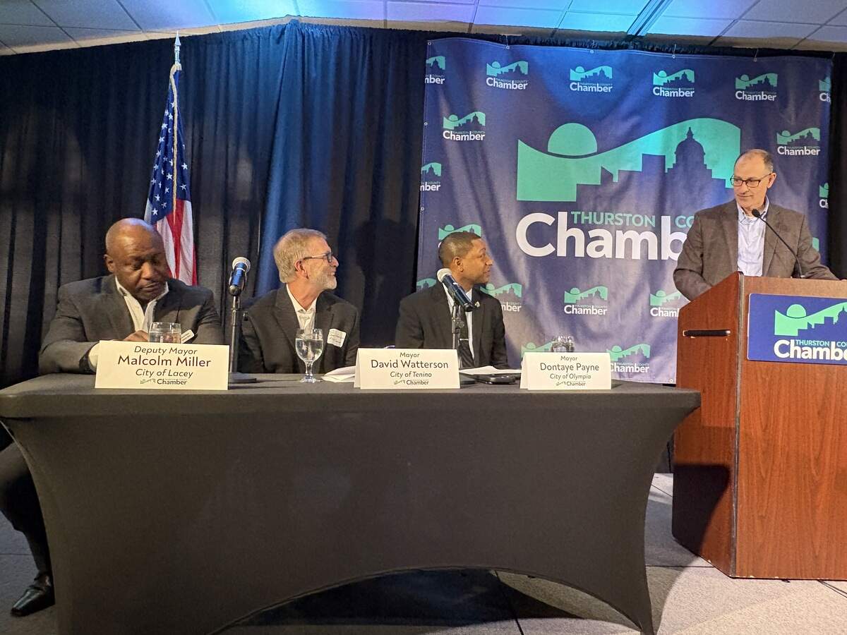 From left: Lacey Deputy Mayor Malcolm Miller, Tenino Mayor David Watterson and Olympia Mayor Dontae Payne interact with moderator and Thurston County Chamber of Commerce President and CEO David Schaffert during the chamber’s “State of the Community” address on Wednesday at Saint Martin’s University in Lacey.