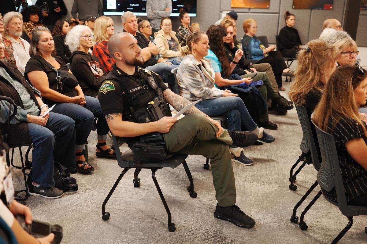 Thurston County Sheriff Derek Sanders waits his turn to speak during a public comment period at a Board of County Commissioner’s meeting on Tuesday, Sept. 30, 2025. Sanders rallied his supporters to the meeting at The Atrium as the board considers budget cuts for 2026.