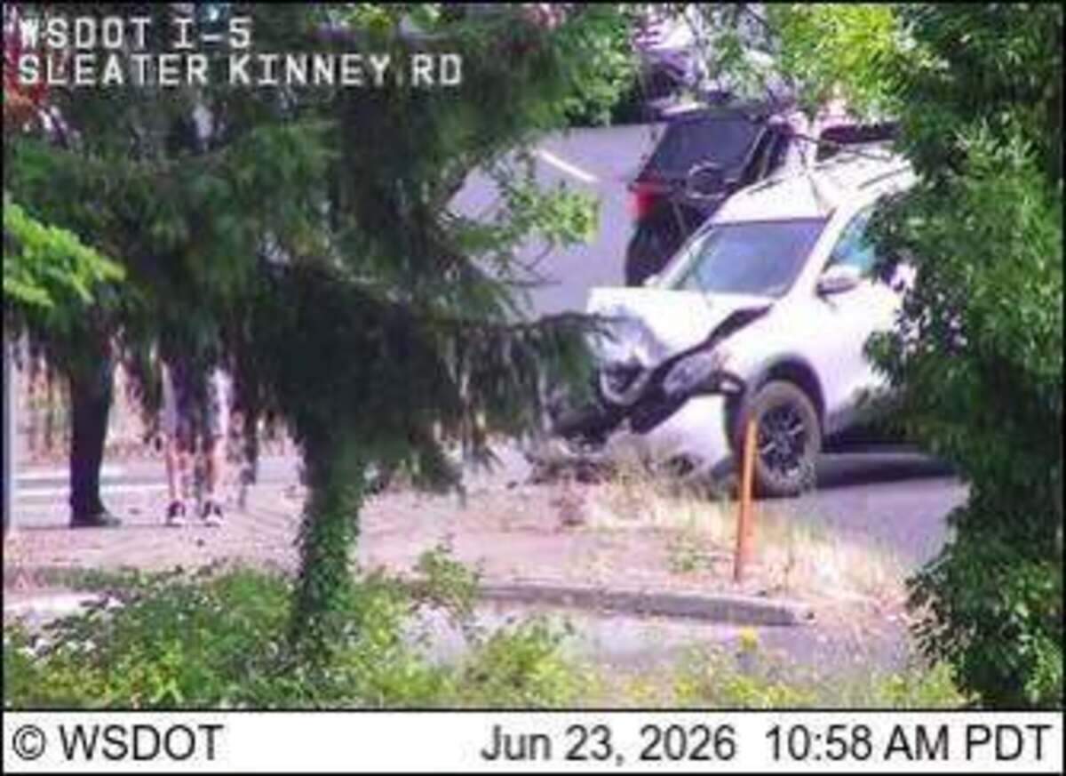 Olympia police search for a white or light pickup truck after a hit-and-run crash on Sleater-Kinney Road near I-5; no injuries reported and one lane closed for about an hour.