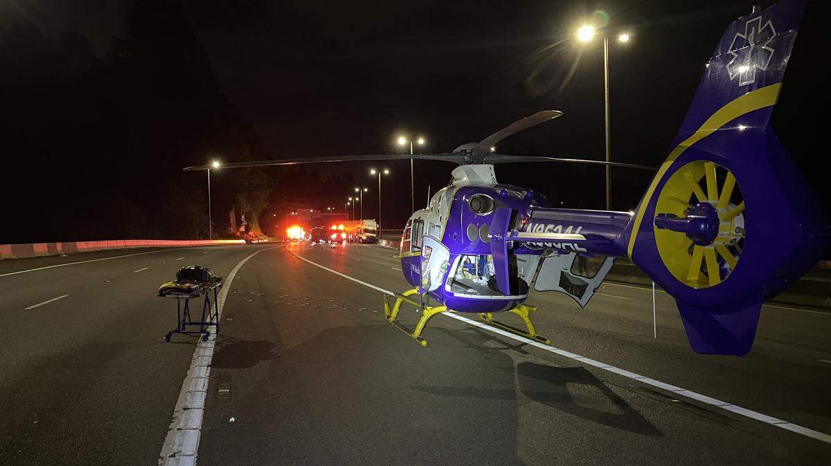 A helicopter prepares to leave the scene after a wrong-way driver on I-5 in Thurston County crashed into a semi-truck early Sunday.
