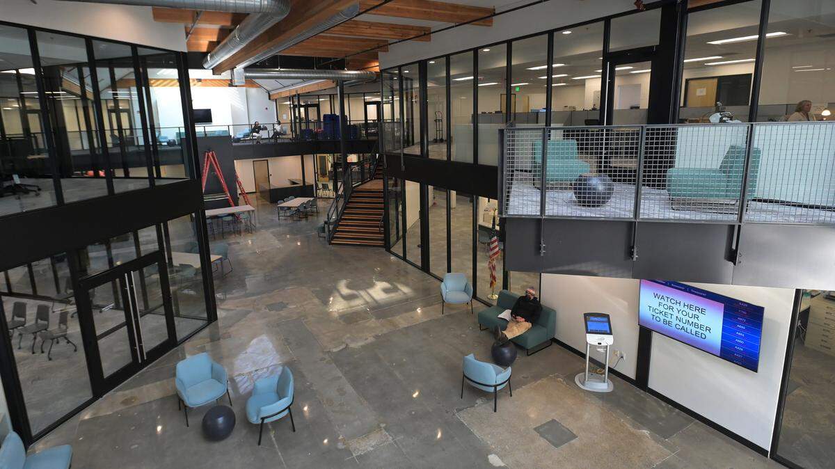 Shown: main entrance ….Assistant County Manager Robin Campbell gives a Dec. 13, 2022 tour of The Atrium, Thurston County’s new 90,000-square-foot office complex locate at 3000 Pacific Ave. in Olympia.