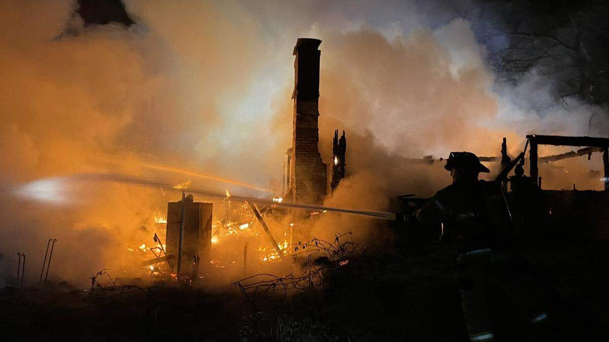 Lacey Fire District 3 firefighters at the site of a house fire on Lindell Road Northeast on Monday night.