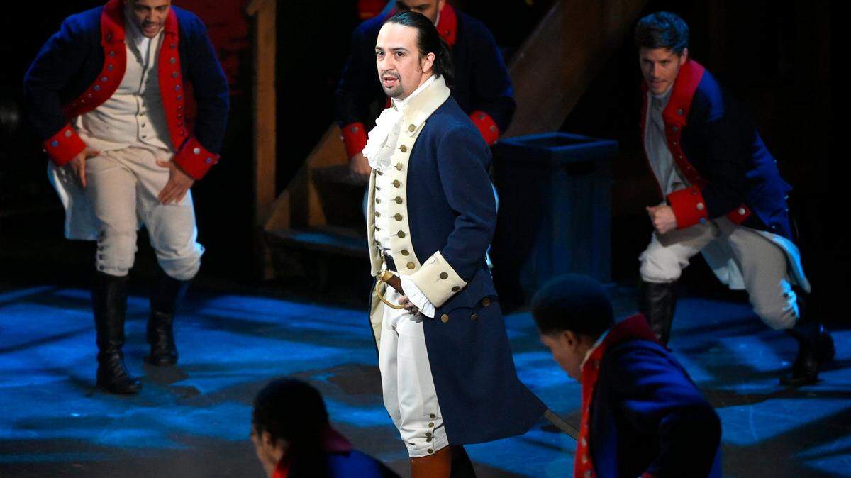 Lin-Manuel Miranda and the cast of “Hamilton” perform at the 2016 Tony Awards in New York. A filmed version of the original Broadway production will be available Friday, July 3, on Disney Plus.
